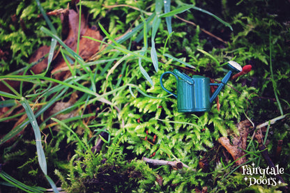 Green fairy garden watering can