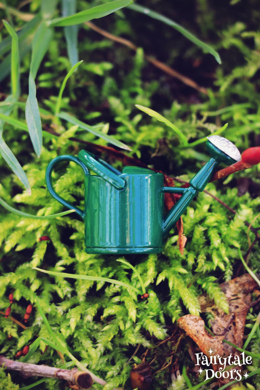 Green fairy garden watering can